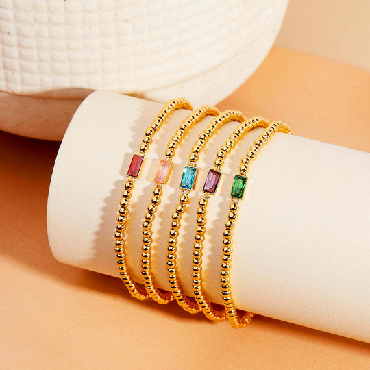Baguette Birthstone Stretch | Gold | Diamond Simulant | Luxe6496 - bangle | Singapore Jewellery, Wedding Rings &amp; Gifts | Same Day Delivery | Tiara.com.sg